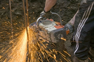 Construction Worker Equipment Drucke: a builder using an angle grinder