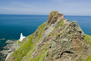 English Coastline Views Drucke: A lighthouse at Hartland Point in Devon UK