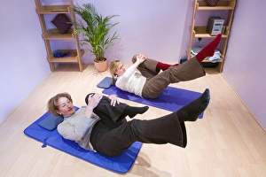 Female Fitness Trainer Drucke: A Pilates instructor and student doing Pilates