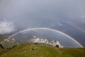 Swiss Mountain Views Drucke: View of double rainbow over mountain landscape