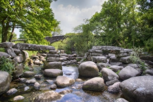 River Dart England Drucke: View of river with partially collapsed clapper bridge