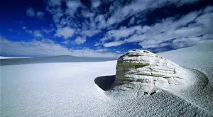 American Southwest Tourism Drucke: A clearing in the clouds allows for an ancient yardang to stand out in the middle