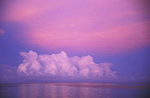 Reflections On The Water Surface Drucke: Clouds and sunset over water