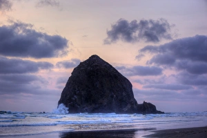 Oregon Coast Scenic Views Drucke: OR, Cannon Beach, Haystack Rock at sunset