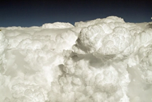 Cumulus Cloud Formations Drucke: View of puffy, white clouds from an airplane