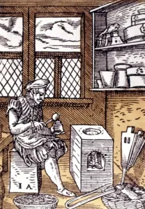 Jost Amman Art Drucke: TYPEFOUNDER, 1568. The Typefounder. Colored woodcut by Jost Amman