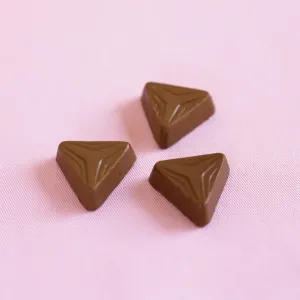Food And Drink Images Drucke: Three triangular shaped chocolates