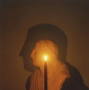 Science Experiment Setup Drucke: Shadow of a bust in candle light