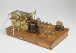 Studio Shot White Background Drucke: Telegraph Receiver printed Morse Code onto Ticker Tape