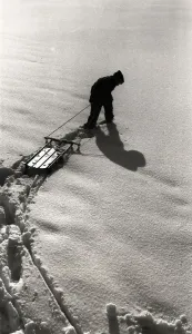 Child In Snow Drucke: Figure Pulling a Sled
