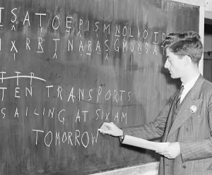 Young Adult Man In Uniform Drucke: Man At Blackboard Deciphering Code