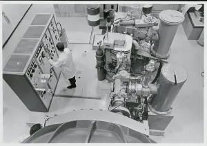 Science Lab Equipment Drucke: Man Working at Accelerator Controls