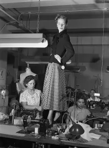Vintage Clothing Trends Drucke: Model Standing on Table and Being Fitted