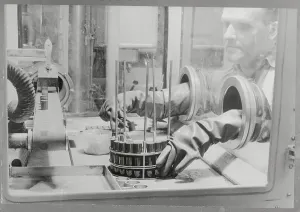 Nuclear Power Plant Safety Drucke: Protected Technician Working with Uranium