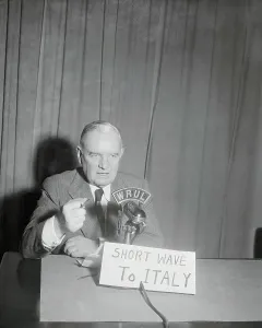 World War II Era Drucke: William Donovan Speaking at Microphone