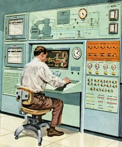 Ein Mann sitzt an einem alten Computer