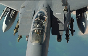 Air Superiority Fighters Drucke: An F-15 Strike Eagle prepares to refuel