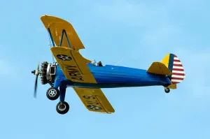 US Army Aviation History Drucke: A Model 75 replica biplane in flight