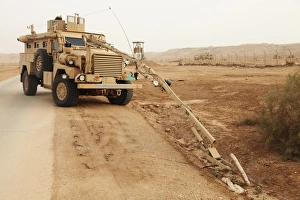 Middle East Military Operations Drucke: A MRAP vehicle disassembles an improvised explosive device
