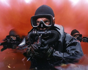 Scuba Diving Equipment Drucke: Navy divers on a training reconnaissance exercise