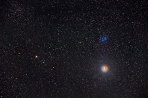 Lunar Eclipse Photography Drucke: Partial eclipse of the moon below the Pleiades star cluster in Taurus