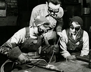 Women In Industry History Drucke: Two women learning to weld with their instructor