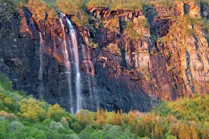 Nordland Norway Landscapes Drucke: Waterfall cascading over cliffs during midnight sun, Nordland, Norway. June, 2022