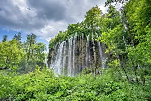 Waterfall In Southern Europe Drucke: Waterfall surrounded by forest, Plitvice Lakes National Park, Croatia. August, 2023