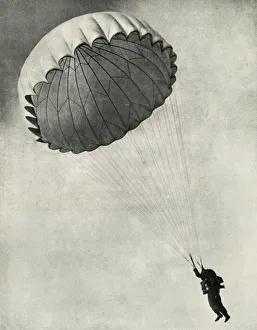 Royal Air Force Images Drucke: Airman using a parachute during the Second World War, 1941. Creator: Charles Brown