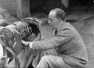 British Racing Driver Drucke: Charles Mortimer working on the engine of a MG KN Special, c1930s Artist: Bill Brunell