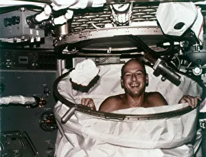 American Space Program Drucke: Conrad in shower facility aboard Skylab 2, 1973. Creator: NASA