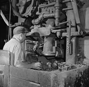 Second World War Manufacturing Drucke: A core blowing machine, New Britain, Connecticut, 1943. Creator: Gordon Parks