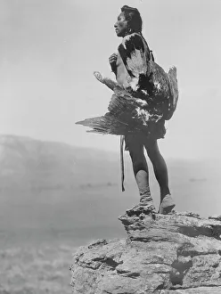 Black And White Bird Photos Drucke: The eagle catcher, c1908. Creator: Edward Sheriff Curtis