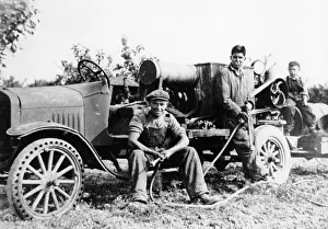 Vintage Farm Equipment Images Drucke: Farmworkers with a tractor, (c1930s?)