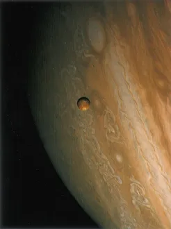 Solar System Exploration Drucke: Jupiter and Io, one of its moons, 1979