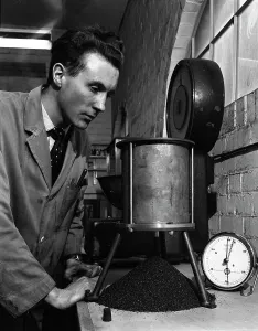 British Coal Industry Drucke: A lab technician undertaking a coal flow test, Mapperley Colliery, Derbyshire, 1962