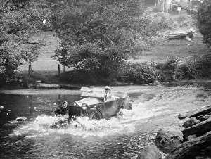 Black And White Car Images Drucke: A Lancia Lambda being driven through water, c1925