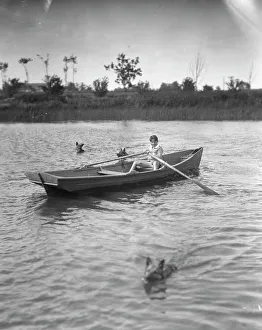 Black And White Bird Photos Drucke: Lewisohn, Walter, Master, in a rowboat, 1926? Creator: Arnold Genthe