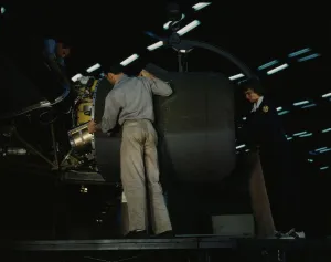 Aeronautical Engineer Drucke: Lowering an engine in place in assembling a C-87