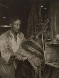 American Art Photography Drucke: Man With A Saddle, c1920s. Creator: Doris Ulmann
