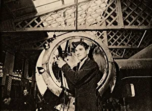 Metal Worker Drucke: A metal worker with automatic drill stripping an engine casing, 1940