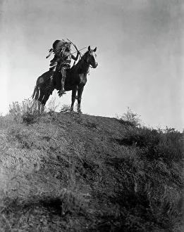 Indigenous People History Drucke: Ready for the charge-Apsaroke, c1908. Creator: Edward Sheriff Curtis