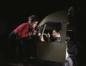 Women In Aviation Industry Drucke: Riveting team working on the cockpit shell of a