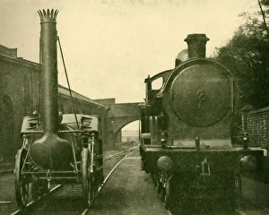 London Midland And Scottish Railway Drucke: A full size model of Stephensons Rocket alongside an engine of the George