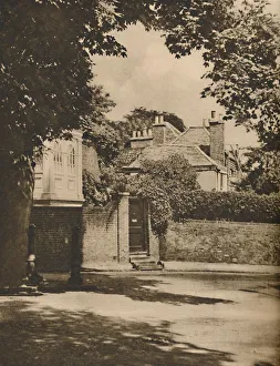 London Landscape Photography Drucke: Sunlight and Shadow in a Winding Highgate Road, c1935. Creator: Paterson