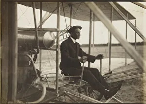 Early Aviation Images Drucke: Wilbur Wright in the flyer, 1908. Creator: Anonymous