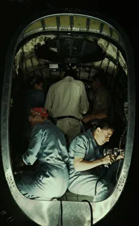 Aeronautical Engineer Drucke: Working inside fuselage of a Liberator Bomber