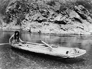American Indian Heritage Drucke: Yurok canoe on Trinity River, c1923. Creator: Edward Sheriff Curtis