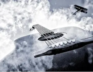 Gerahmter Druck : Gitarrenwolken und Flugzeug. Gerahmter Druck : Gitarrenwolken und Flugzeug.