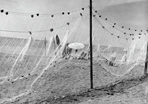 Vintage Fishing Equipment Drucke: Fishing net on the beach